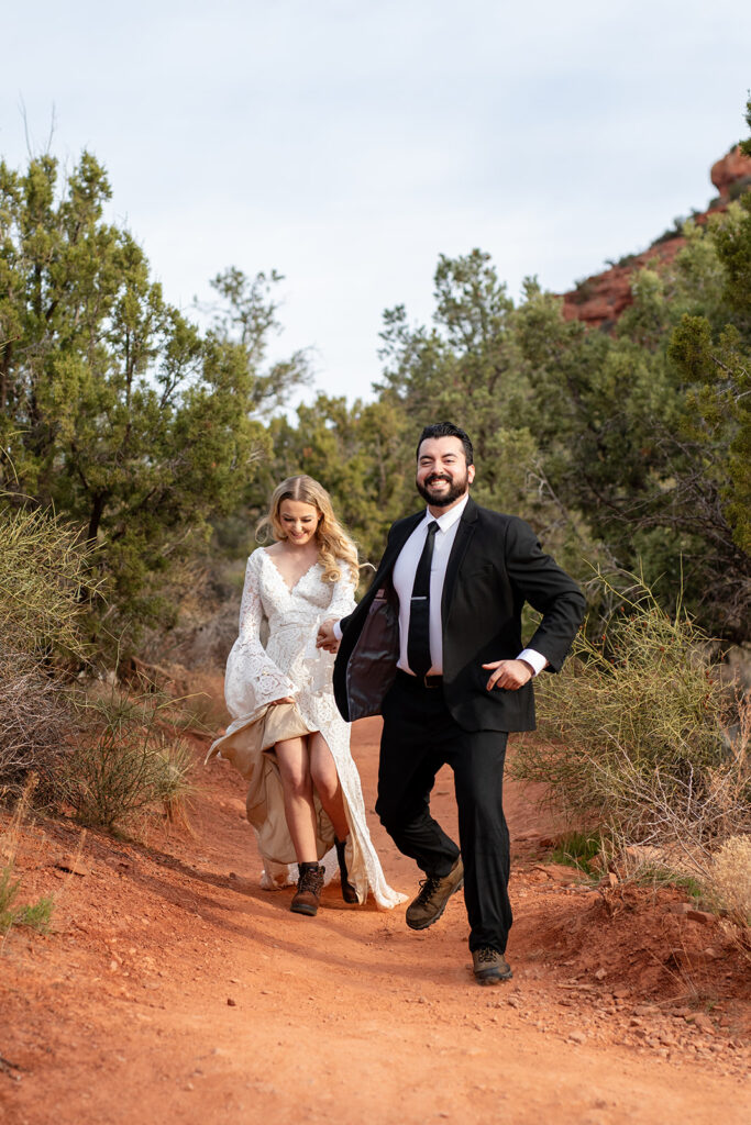 bride and groom hiking the Thunderbird Trail in Arizona