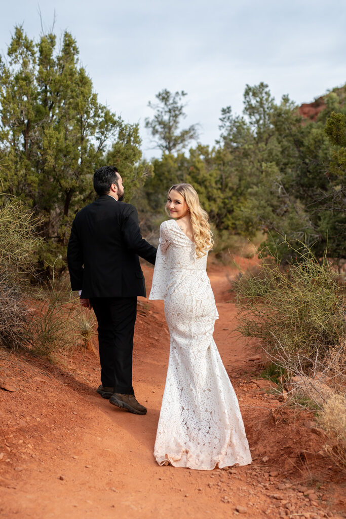 bride and groom hiking the Thunderbird Trail in Arizona