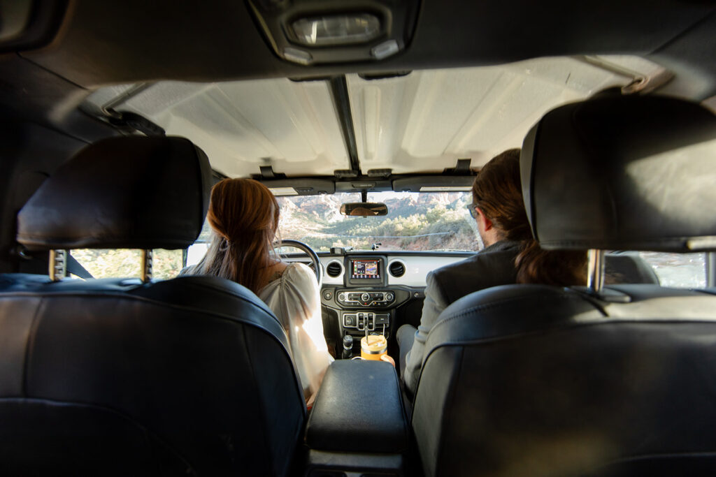 bride and groom driving to their elopement location in arizona