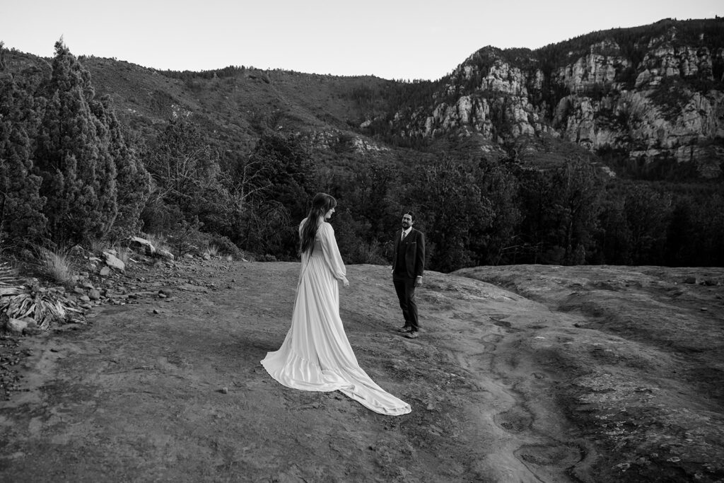 black and white elopement photo of the couple with sedona landscapes in the backdrop