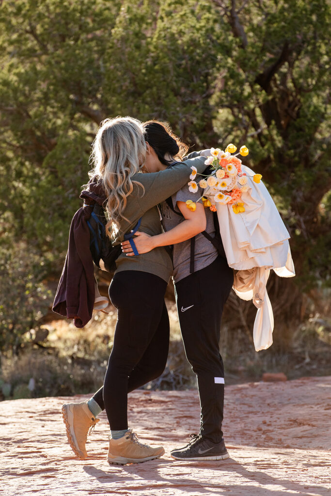 sweet couple going on a hike in sedona az to get to their elopement ceremony spot