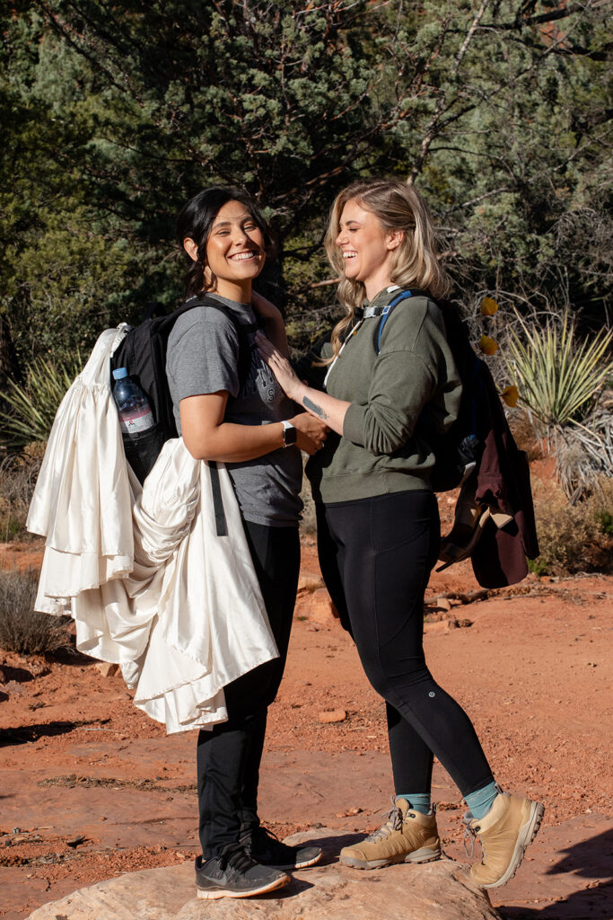 sweet couple going on a hike in sedona az to get to their elopement ceremony spot