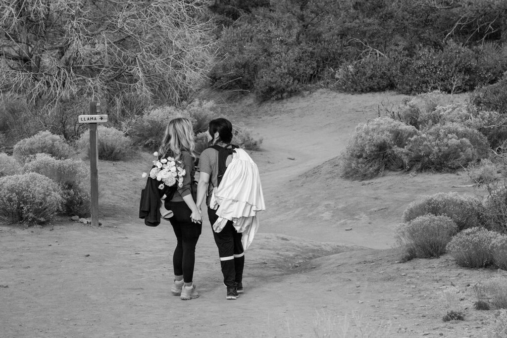 sweet couple going on a hike in sedona az to get to their elopement ceremony spot