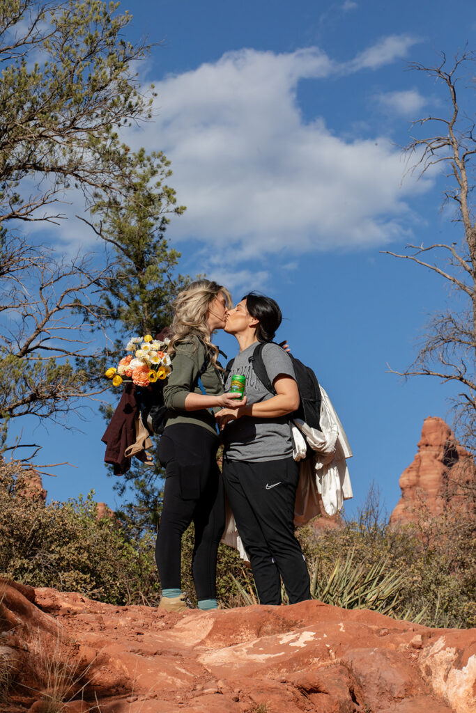 sweet couple going on a hike in sedona az to get to their elopement ceremony spot