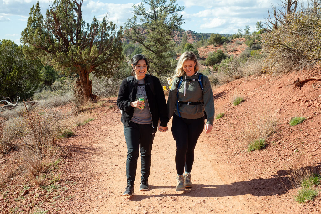 sweet couple going on a hike in sedona az to get to their elopement ceremony spot