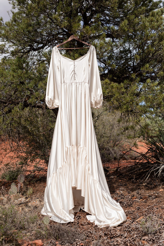 elopement attire hung on a tree 