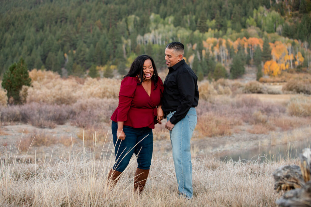 playful engagement photo in a field