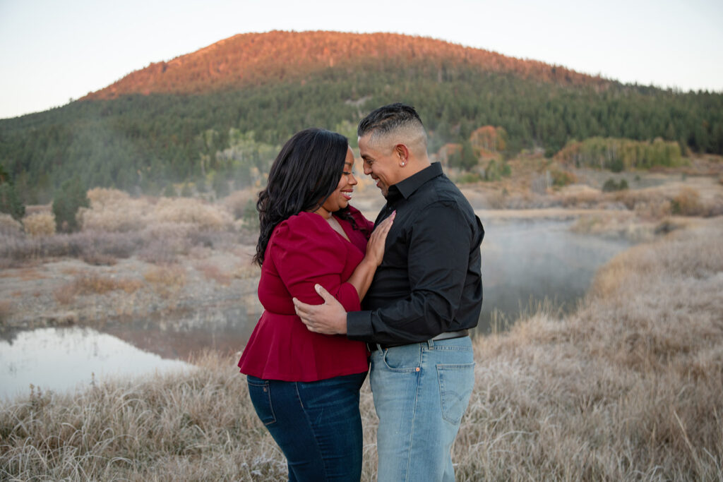 playful engagement photo in a field