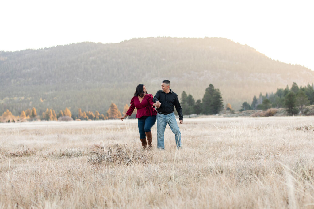 playful engagement photo in a field