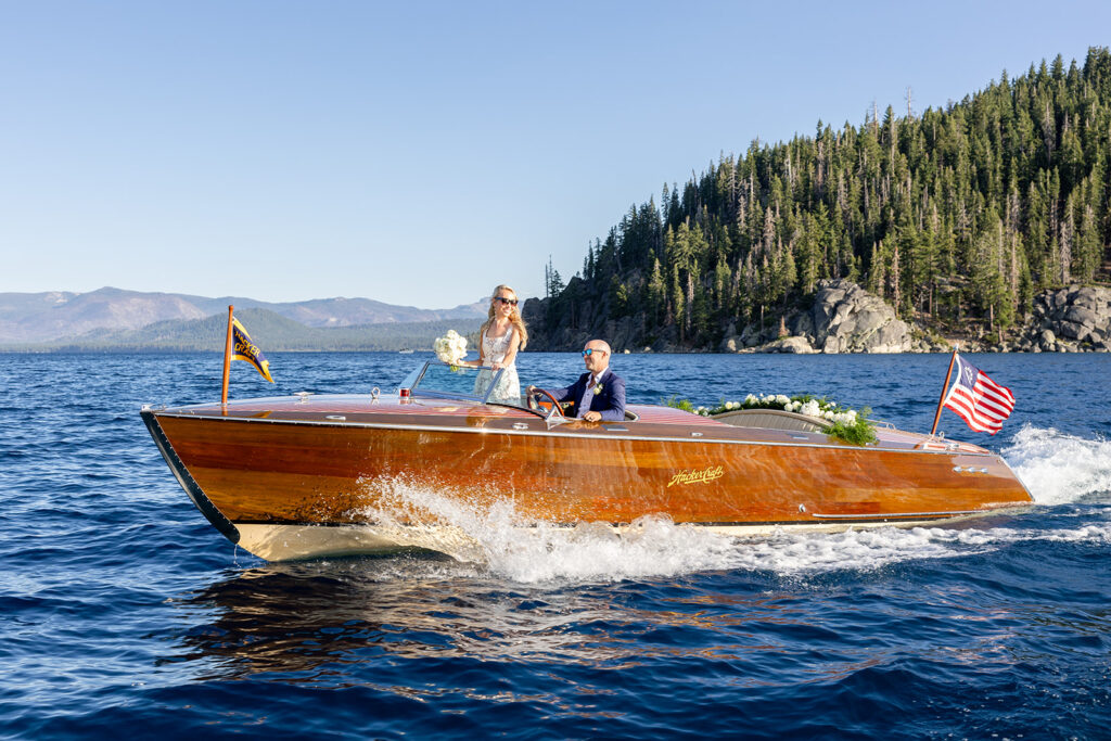 fun bride and groom photos in a classic boat on lake tahoe