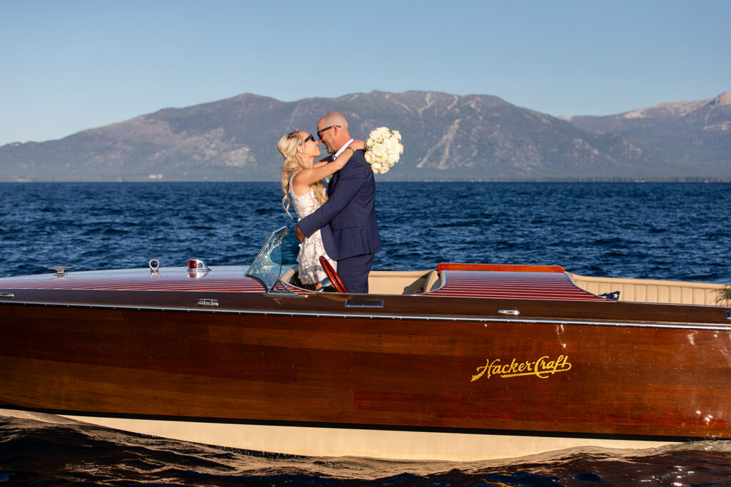 fun bride and groom photos in a classic boat on lake tahoe