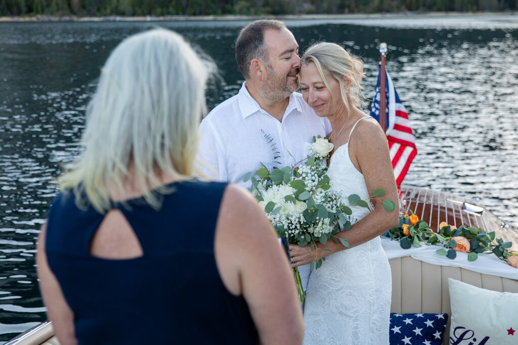 an intimate elopement ceremony on a boat in Lake Tahoe