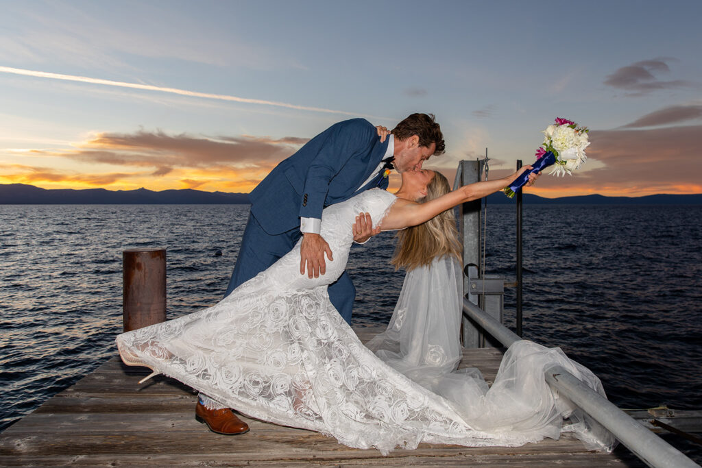 elopement couple sunset dip kiss on Lake Tahoe