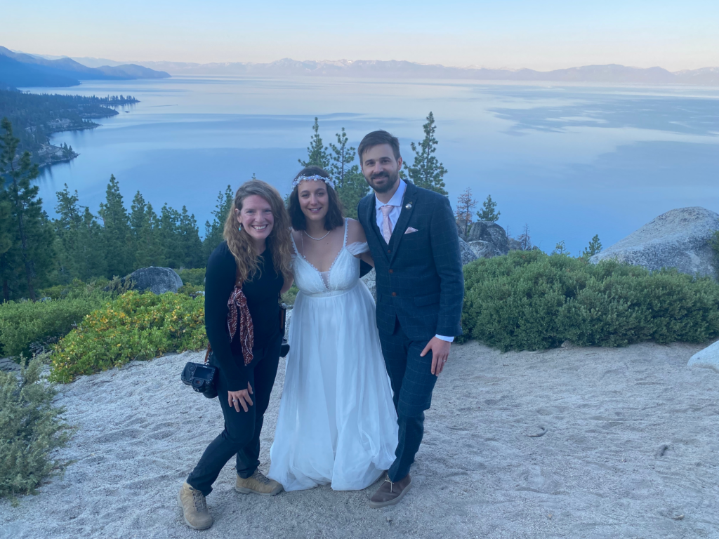 lake tahoe elopement planner and photographer posing with the couple during the elopement day