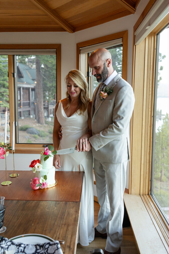 bride and groom cutting cake