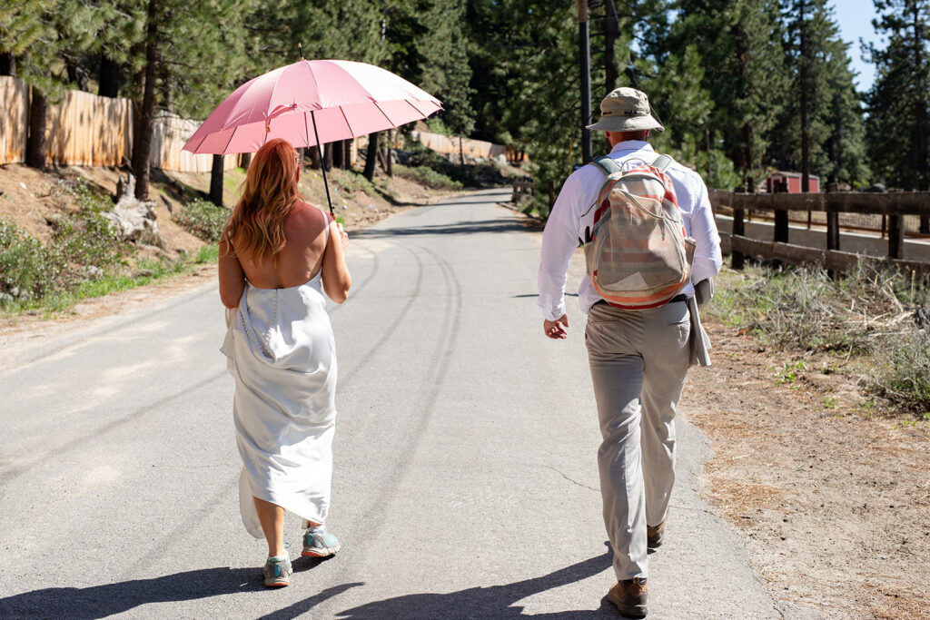 bride and groom going on a hike during their micro wedding in Lake Tahoe