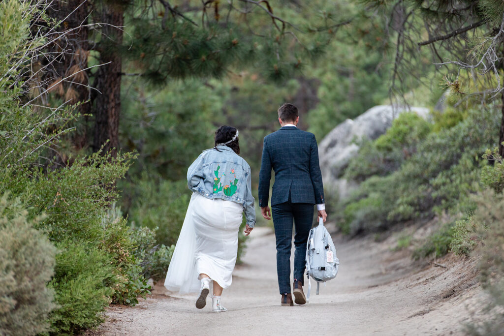 elopement couple hiking to their monkey rock elopement ceremony location