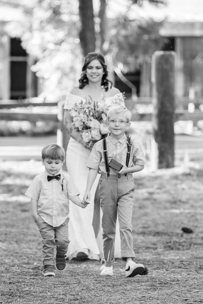 bride and her little sons walking down the aisle