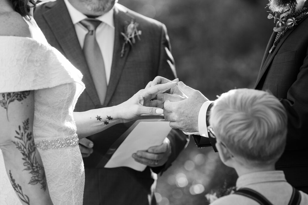 elopement couple holding hands during their elopement ceremony in skylandia park, tahoe