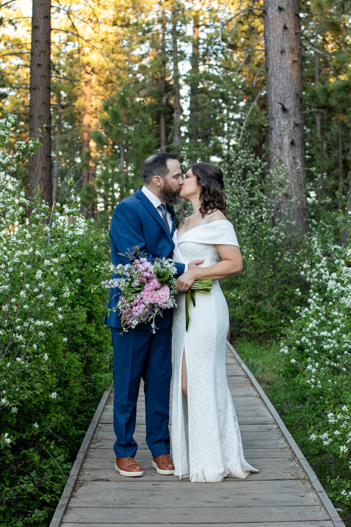 bride and groom in a lush forest at skylandia park, tahoe