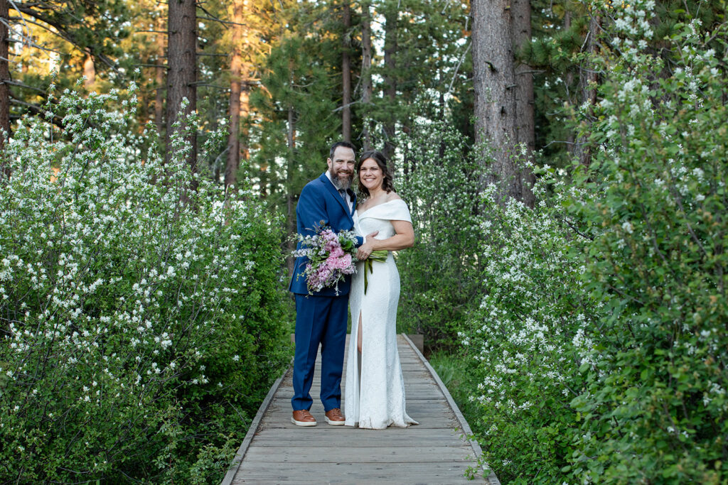 bride and groom in a lush forest at skylandia park, tahoe