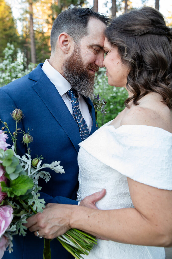 bride and groom in a lush green forest in Lake Tahoe