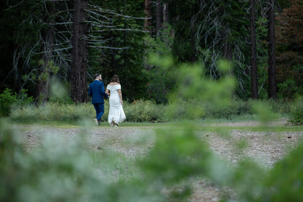 bride and groom in a lush forest at skylandia park, tahoe