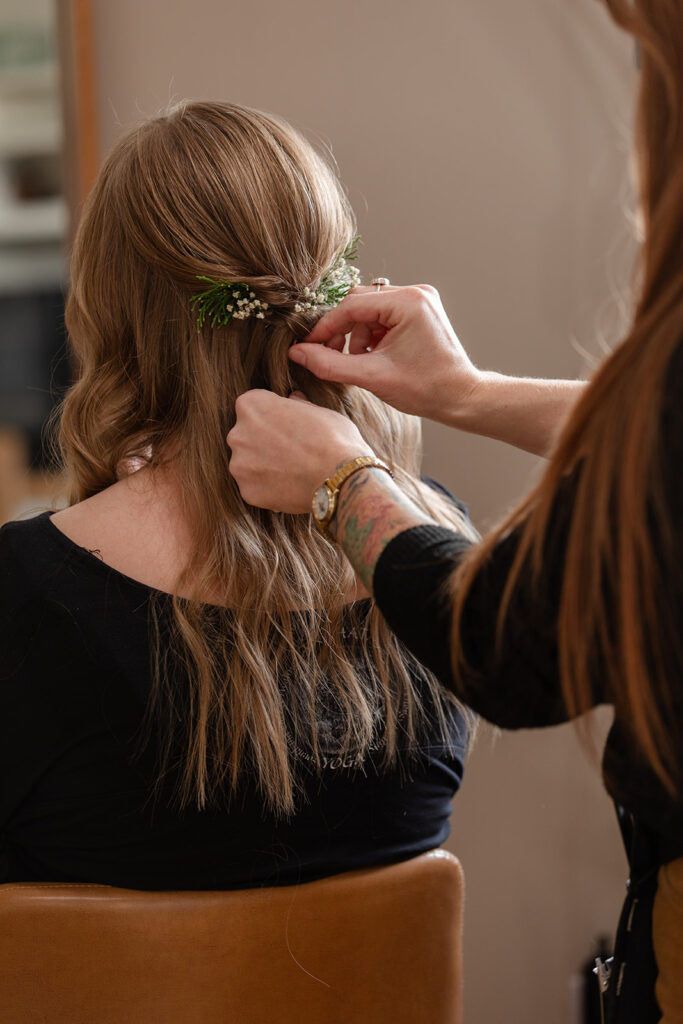 bride getting her hair and make up done at the airbnb