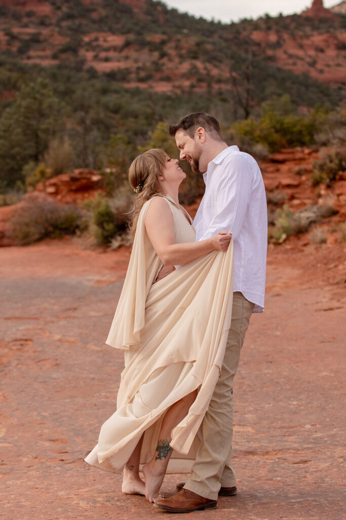 romantic Sedona elopement couple surrounded by red rock landscapes