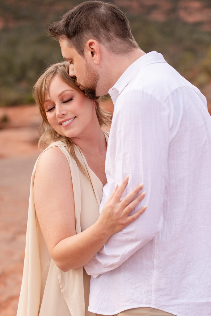 romantic Sedona elopement couple surrounded by red rock landscapes