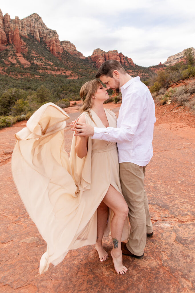 romantic Sedona elopement couple surrounded by red rock landscapes