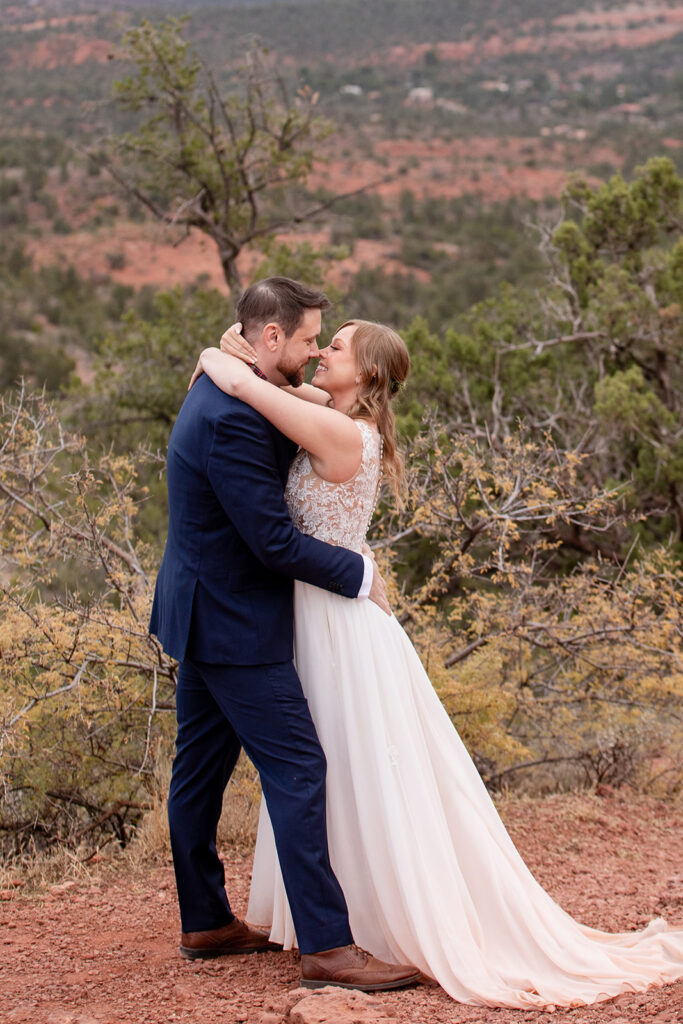 bride and groom sharing their first kiss