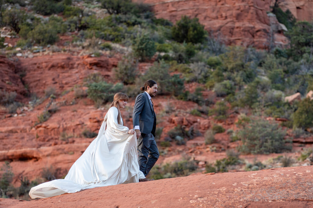 elopement couple surrounded by stunning landscapes of sedona az