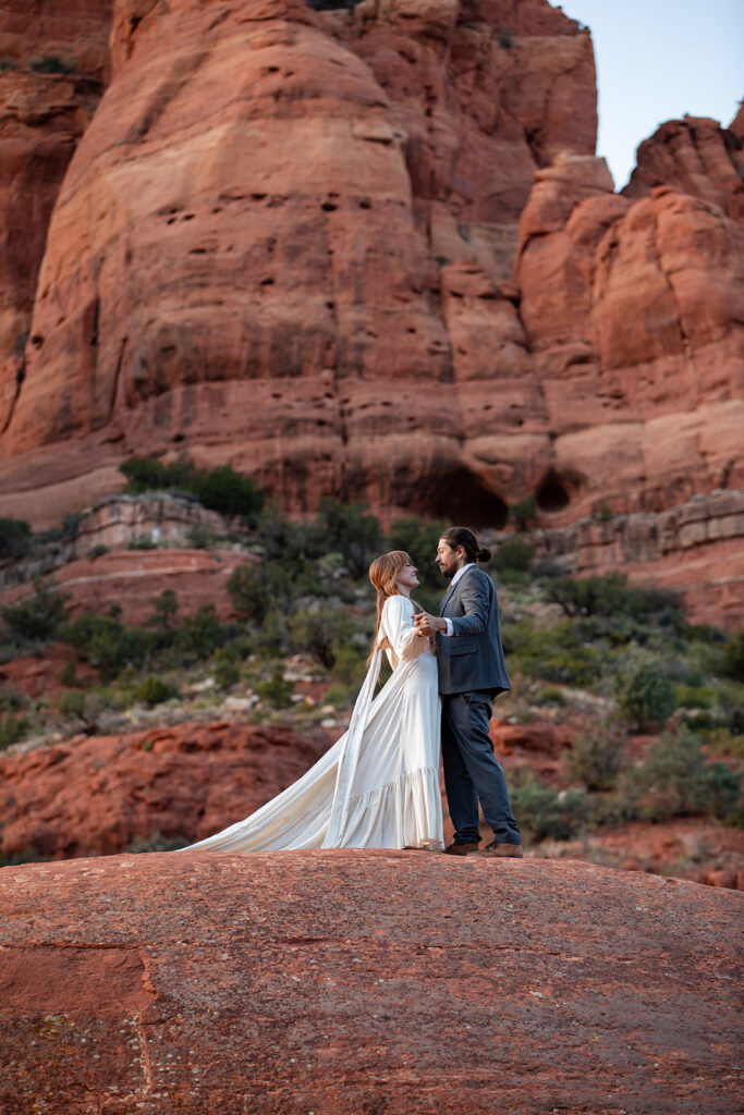 elopement couple surrounded by stunning landscapes of sedona az