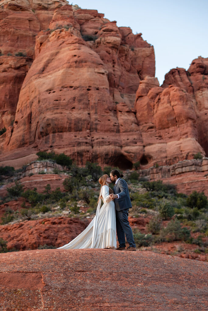 elopement couple surrounded by stunning landscapes of sedona az