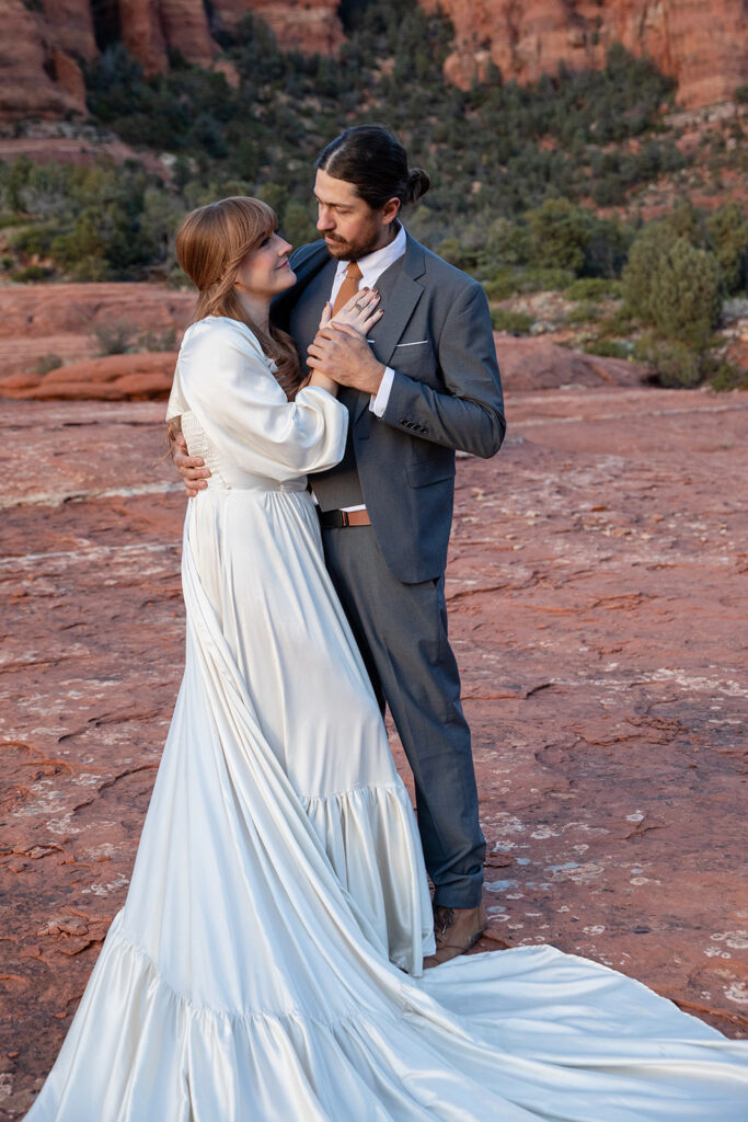 elopement couple surrounded by stunning landscapes of sedona az