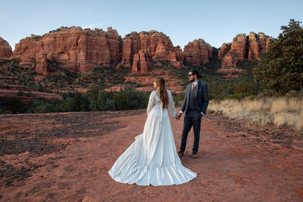 elopement couple surrounded by stunning landscapes of sedona az