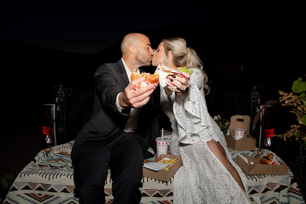 couple enjoying fast food during their elopement day