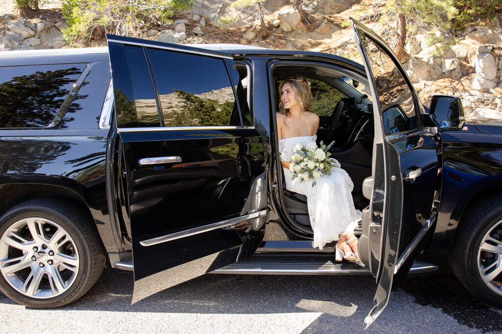 bride getting out of a jeep 