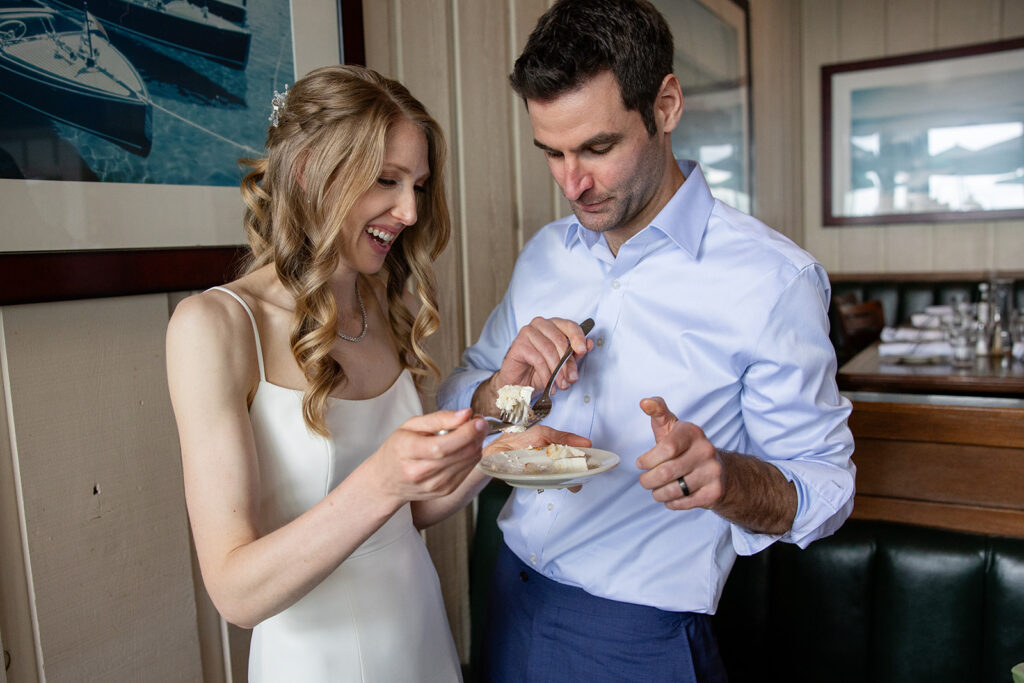 bride and groom cutting cake