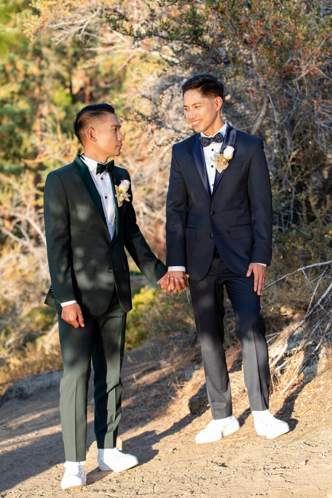 sweet lgbtq couple during their hiking elopement in logan shoals, lake tahoe