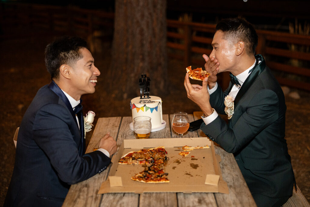 lgbtq elopement couple celebrating their day at a brewery with pizza