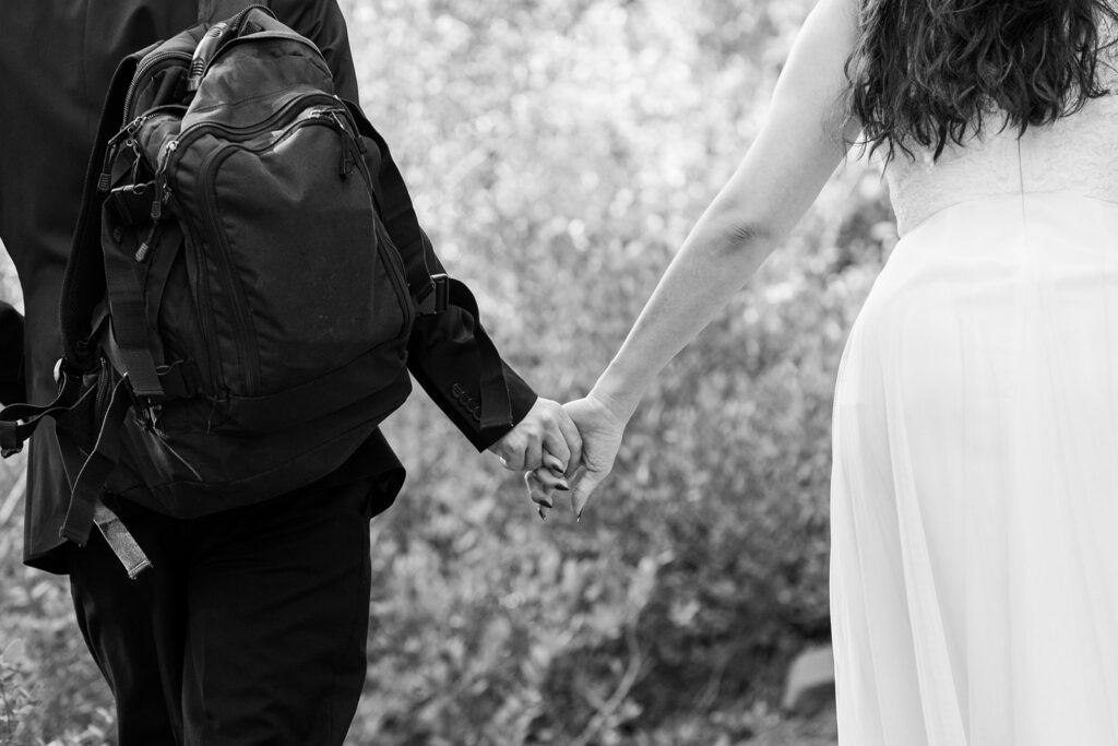 elopement couple hiking to Monkey Rock for their beautiful, simple elopement day