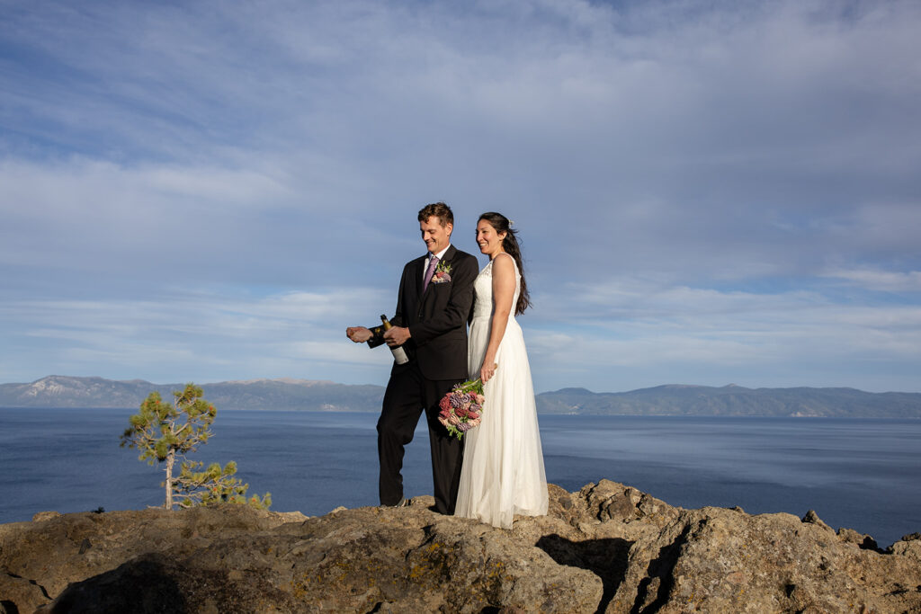 bride and groom enjoying a glass of champagne together during their simple elopement day at lake tahoe