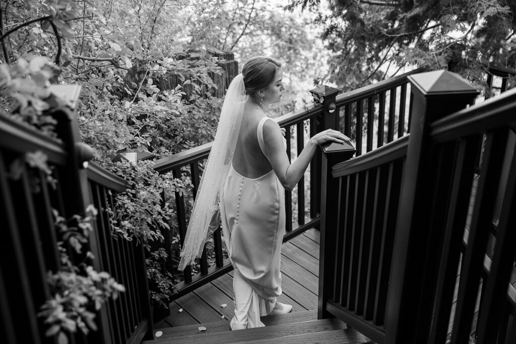 bride heading down some steps for the first look