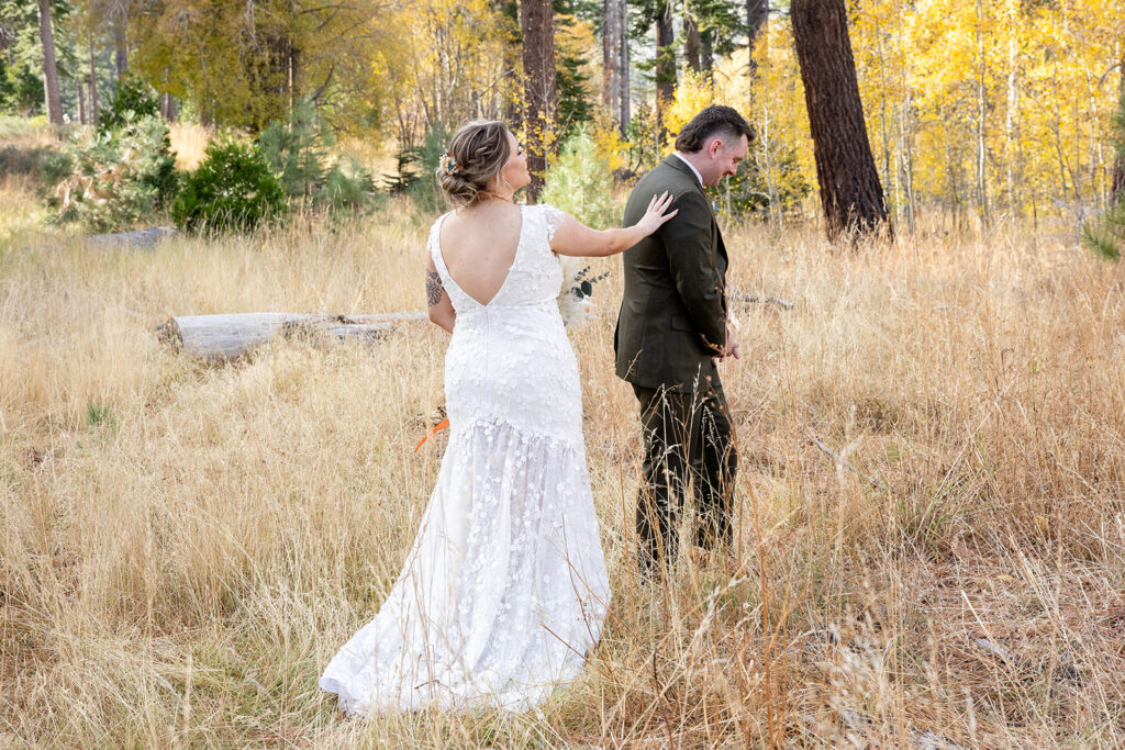 bride and groom first look at taylor creek for their south lake tahoe elopement