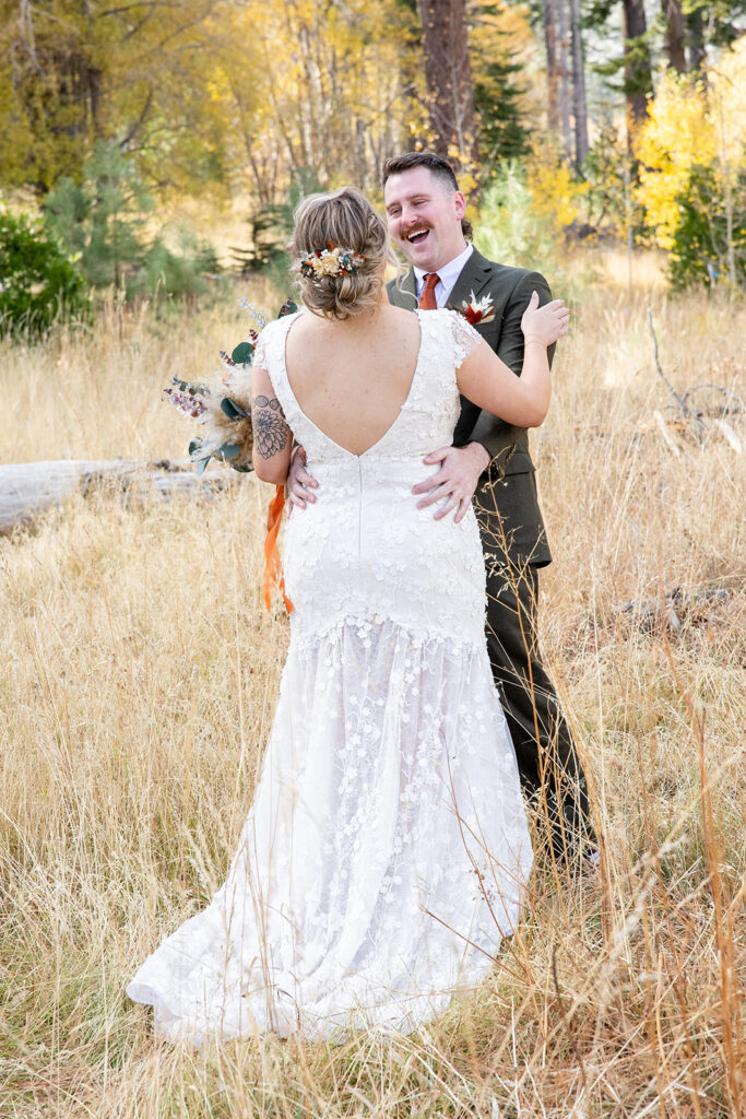 bride and groom first look at taylor creek for their south lake tahoe elopement